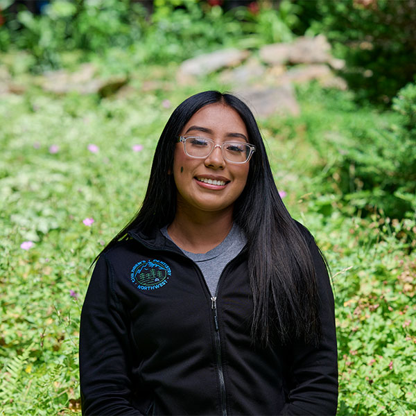 leslienw Young Woman Smiling By Green Wall