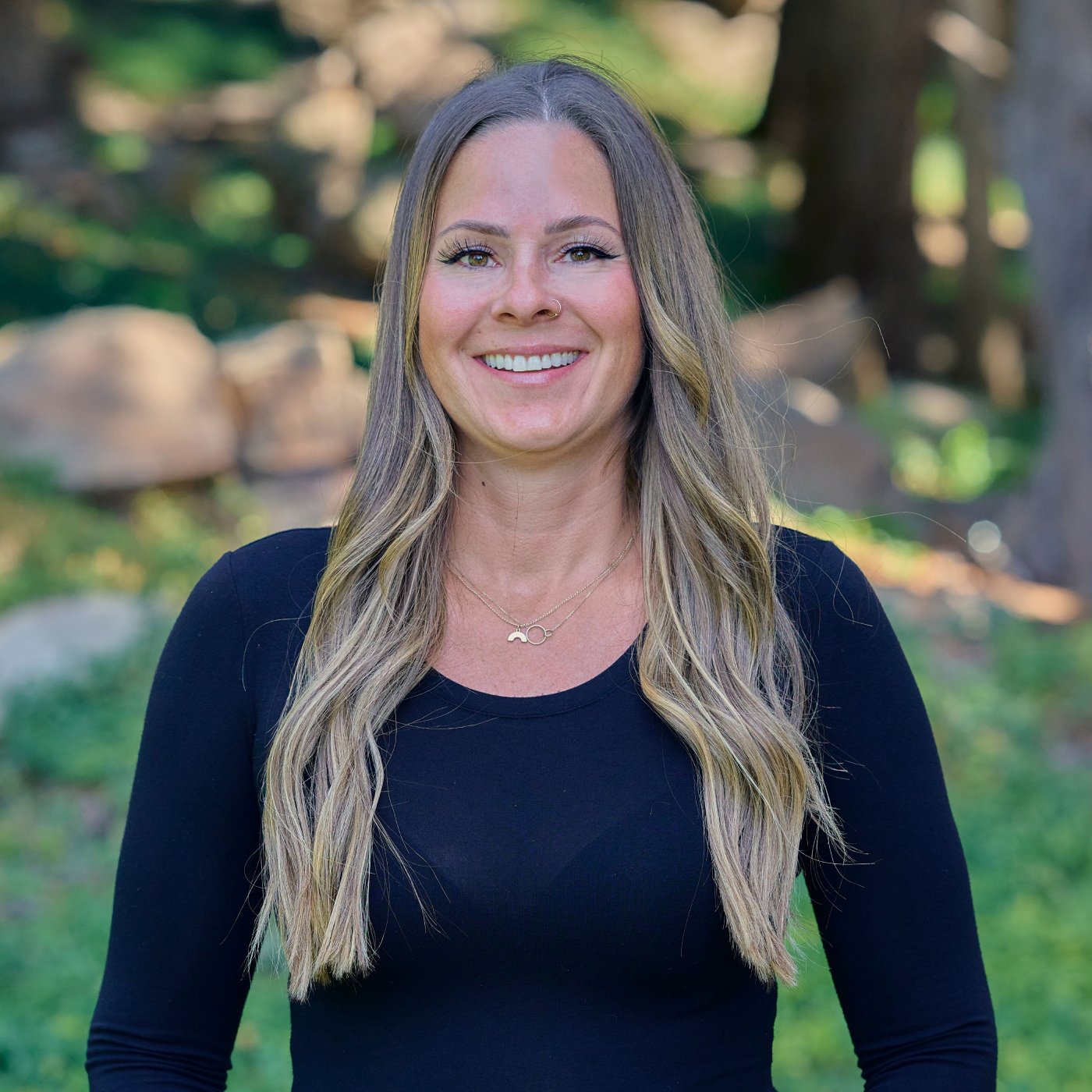 Lacey Young Woman Smiling By Green Wall